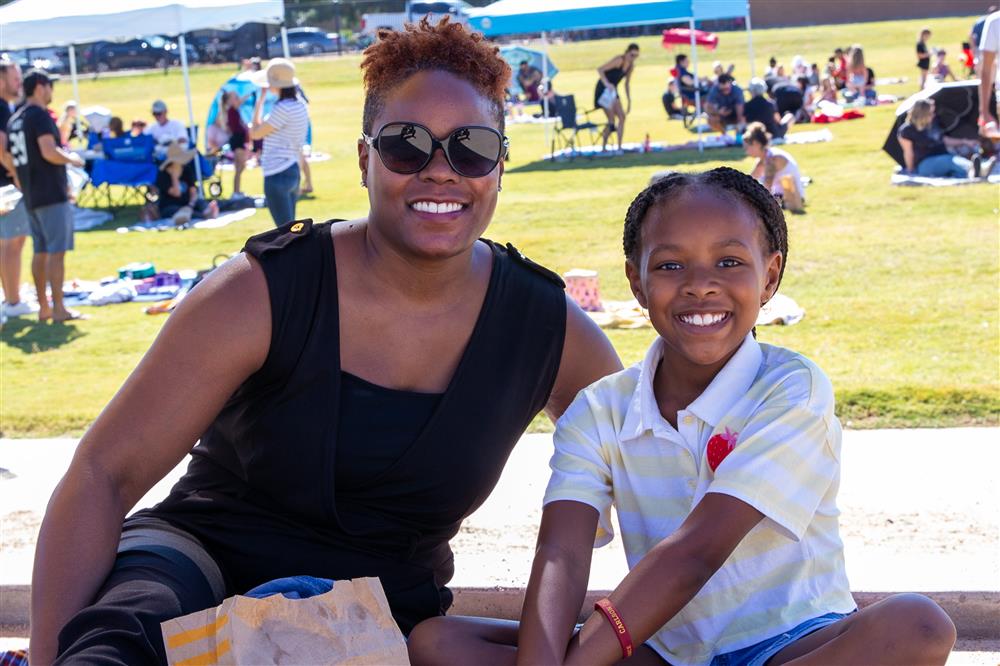 Families visit students during lunch and play games.